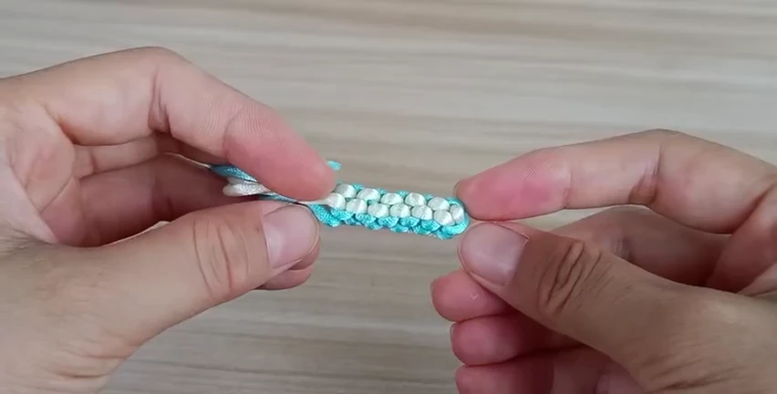Square Cross Good Luck Knot demonstrated with real cord
