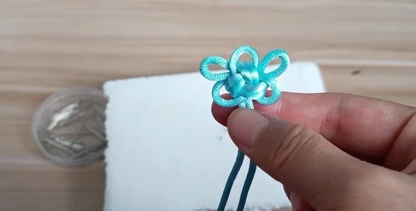 Three-Loop Good Luck Knot demonstrated with real cord