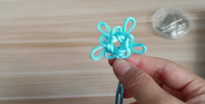 Five-Loop Good Luck Knot demonstrated with real cord
